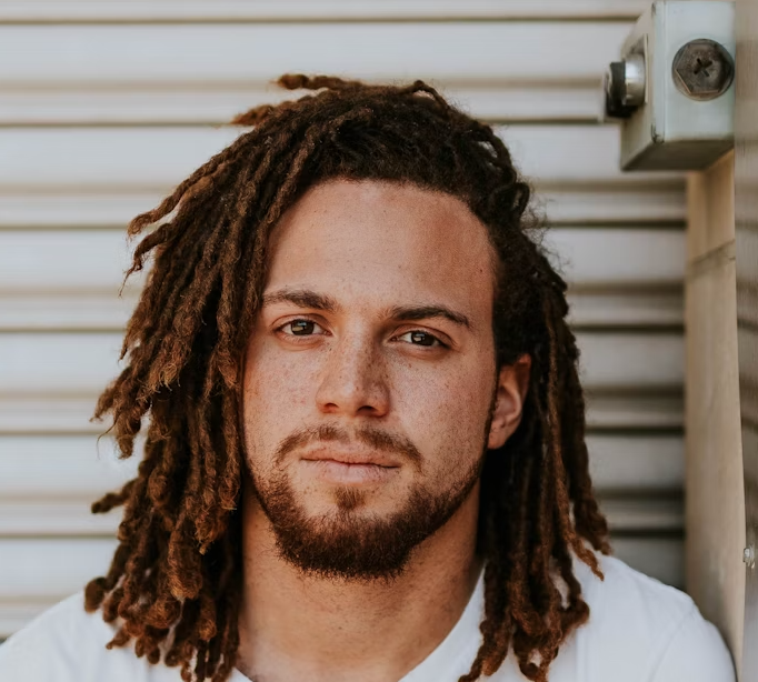 Man with dreadlocks outdoor portrait